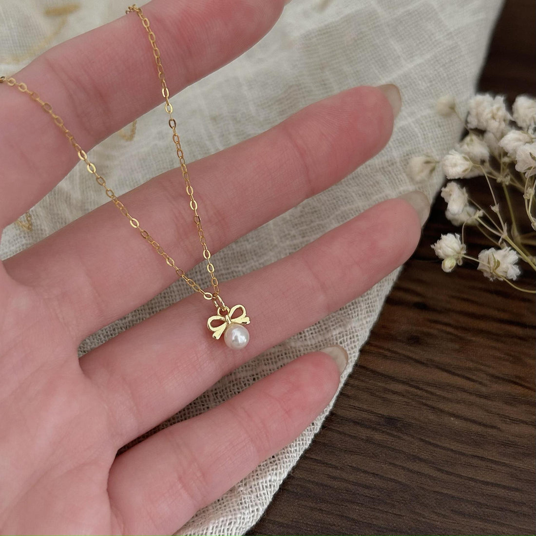 Petite Bow & Pearl-Accent Necklace in Gold-Tone Silver