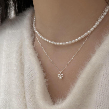 Petite Bow & Pearl-Accent Necklace in Gold-Tone Silver - view 4