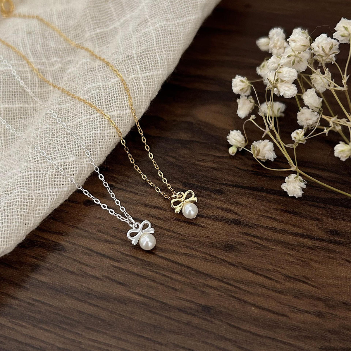 Petite Bow & Pearl-Accent Necklace in Gold-Tone Silver - view 3