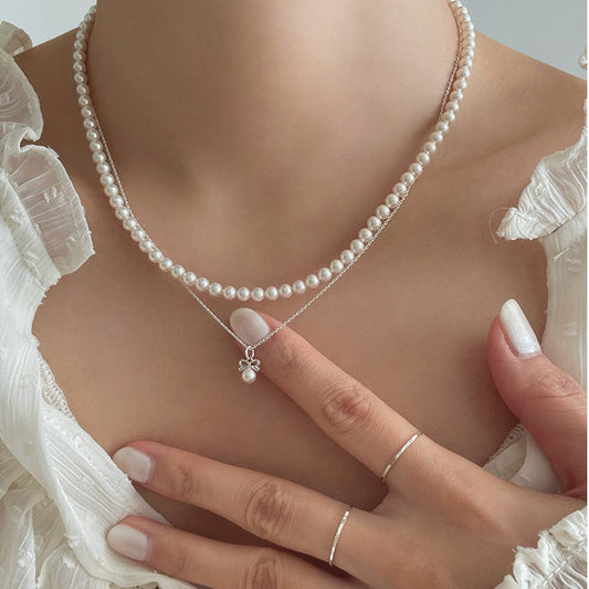 Petite Bow & Pearl-Accent Necklace in Gold-Tone Silver - view 1