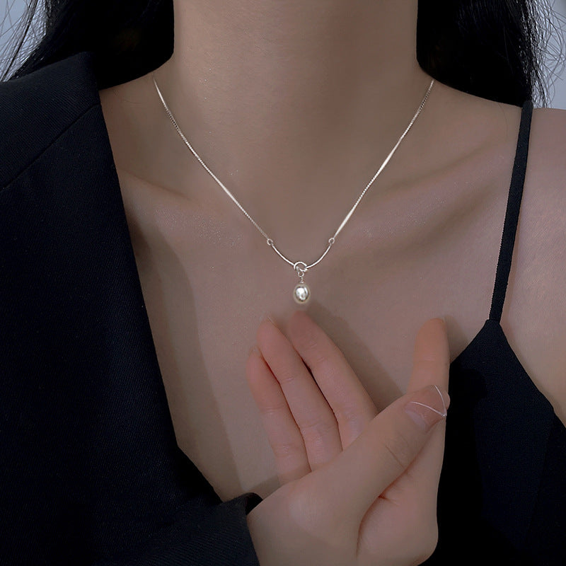 Knot & Pearl Drop Necklace in Gold-Tone Silver