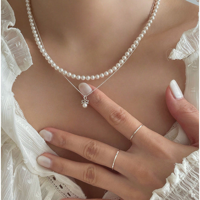 Petite Bow & Pearl-Accent Necklace in Gold-Tone Silver - view 10
