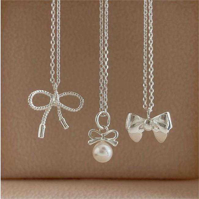 Petite Bow & Pearl-Accent Necklace in Gold-Tone Silver - view 9